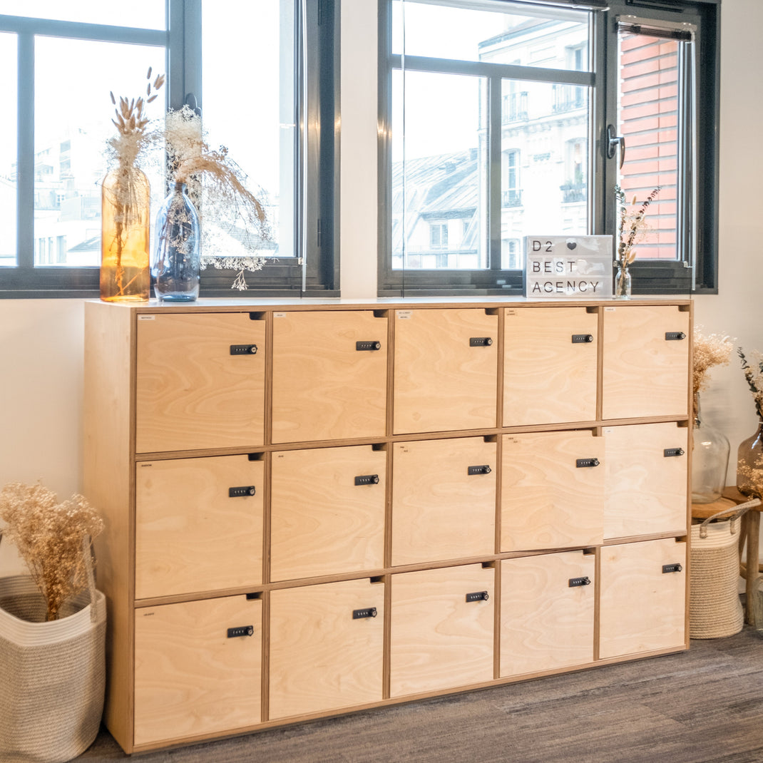 Wooden locker system in a room with large windows