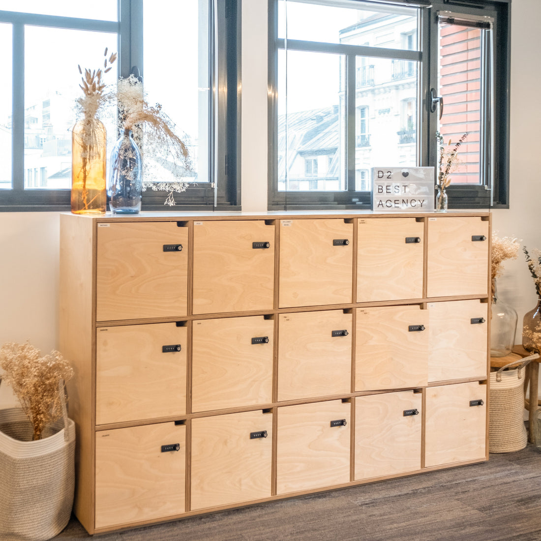 Wooden locker system in a room with large windows