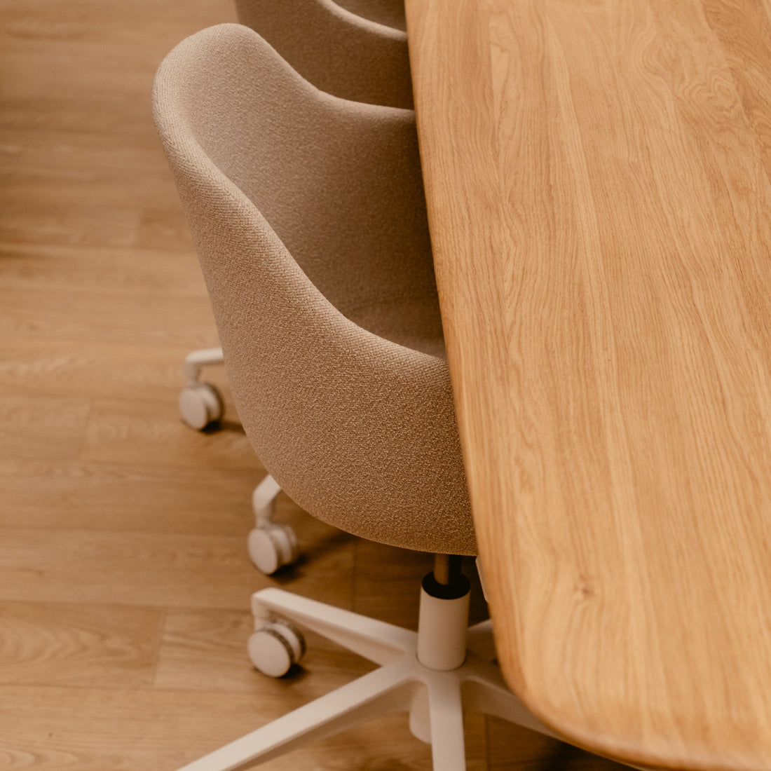 Meeting room wooden table and upholstered ergonomic chairs 
