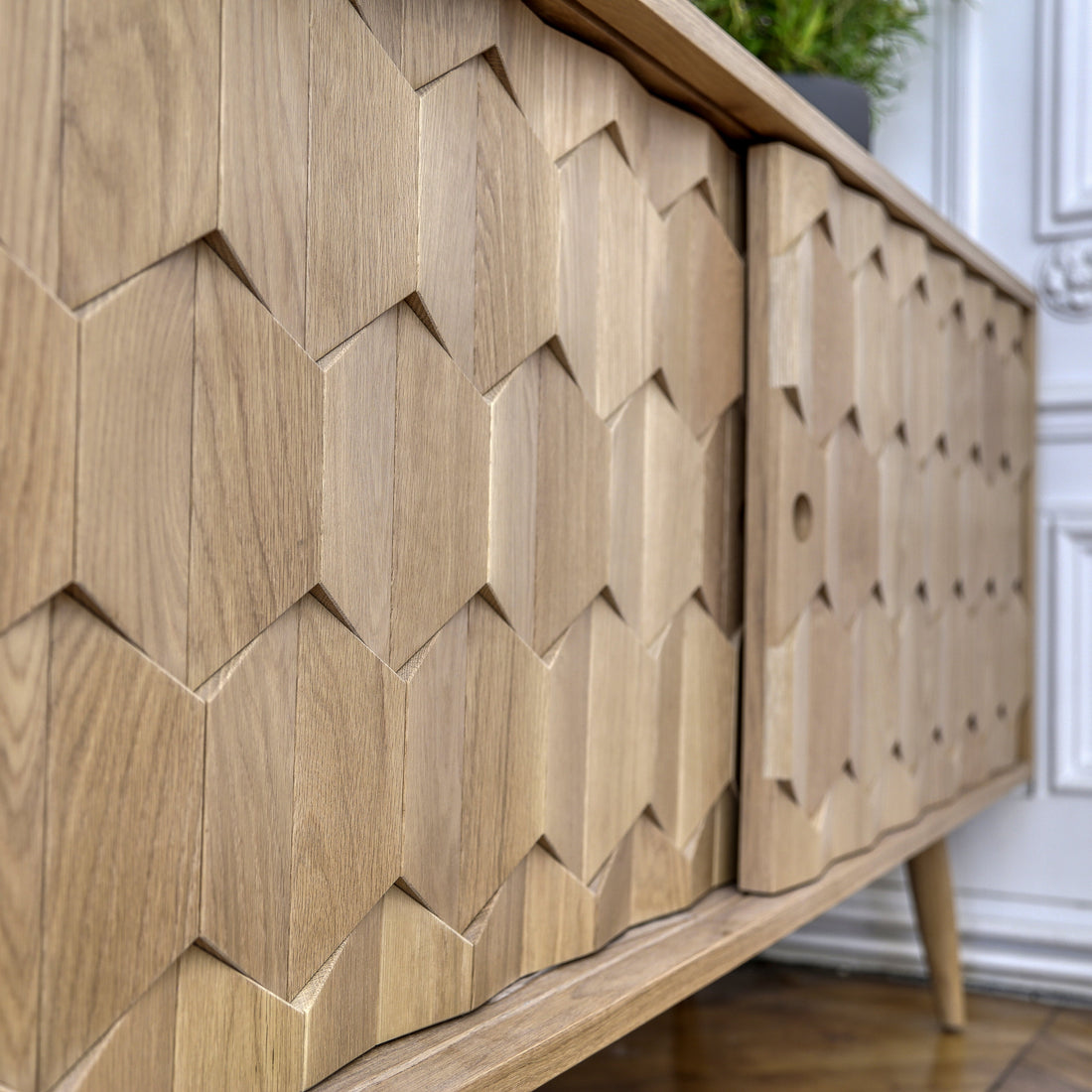 Wooden sideboard storage for office with geometric pattern in a room setting